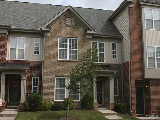 9712 Layla Avenue Raleigh, NC 27617 - Photo 2 of 25 a front view of a house with garden