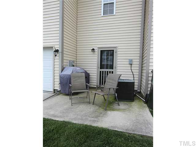 9712 Layla Avenue Raleigh, NC 27617 - Photo 23 of 25 a view of a porch with furniture and a yard