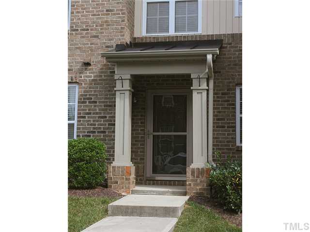 9712 Layla Avenue Raleigh, NC 27617 - Photo 3 of 25 a front view of a house with a garden