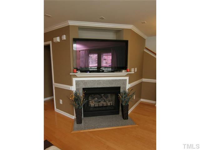 9712 Layla Avenue Raleigh, NC 27617 - Photo 6 of 25 a living room with a fireplace