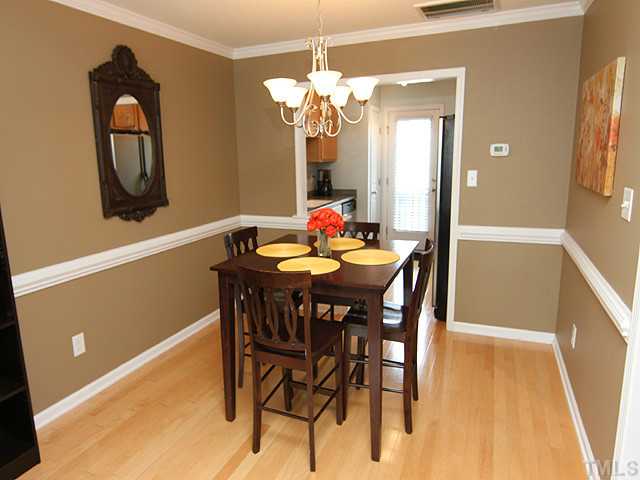 9712 Layla Avenue Raleigh, NC 27617 - Photo 10 of 25 a dining room with furniture and mirror
