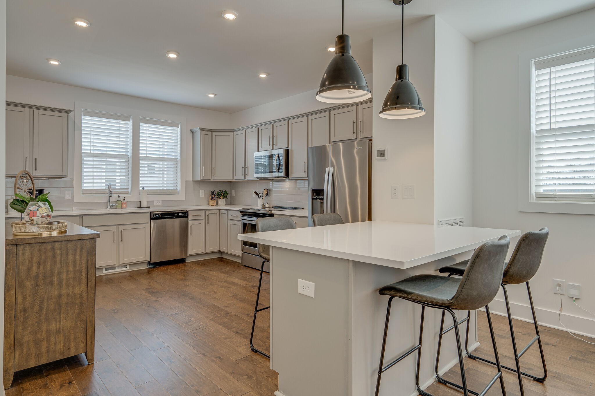 500 Creative Way, Unit 13 Madison, TN 37115 - Photo 11 of 33 a kitchen with a table chairs refrigerator and window