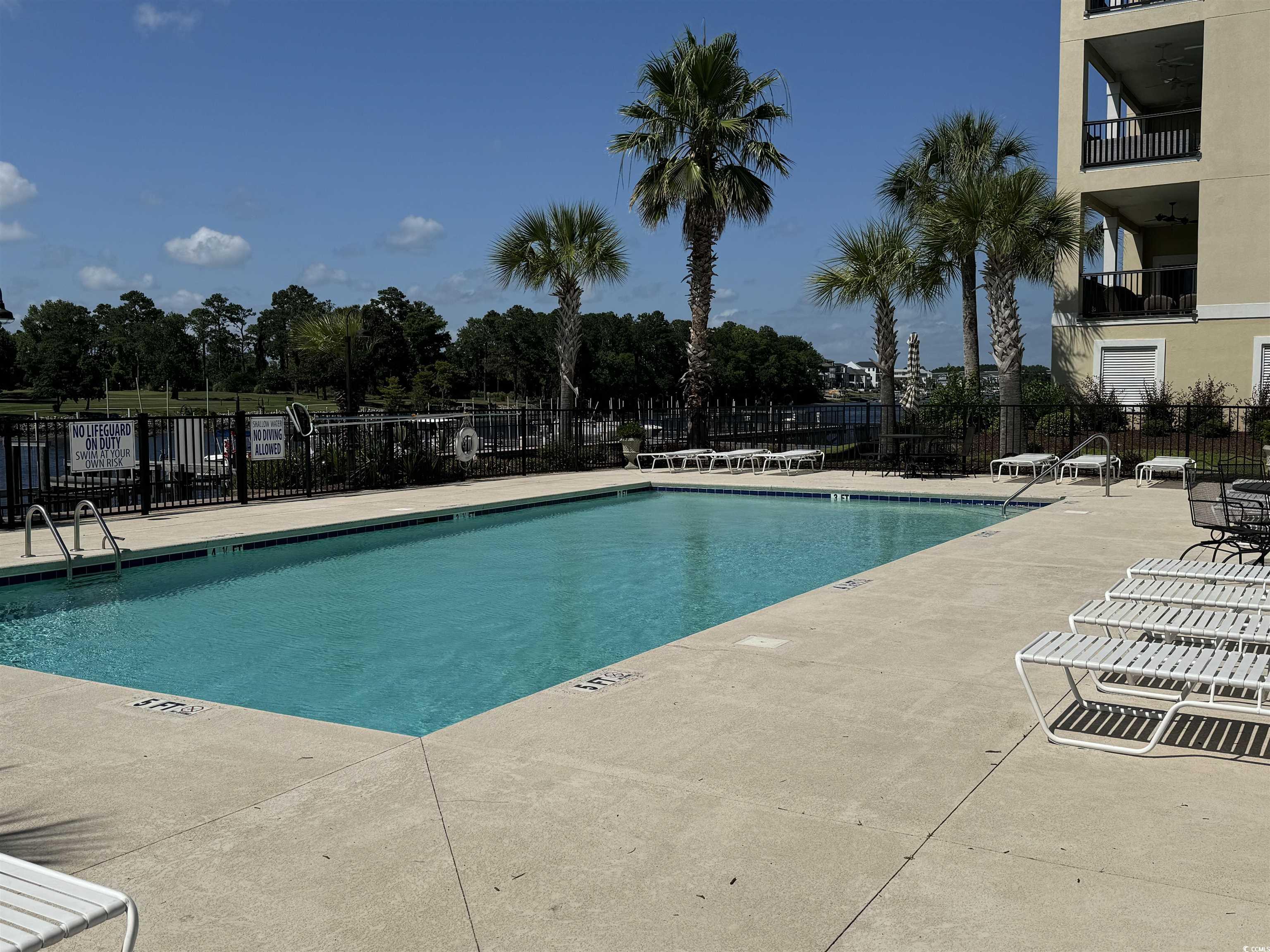 249 Venice Way, Unit 3105 Myrtle Beach, SC 29577 - Photo 34 of 40 View of swimming pool with a patio