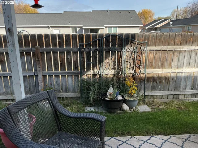 a view of a backyard with sitting area