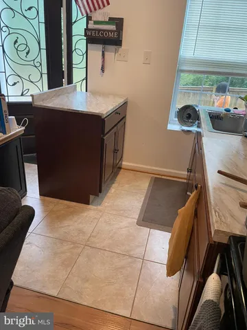 a kitchen with a sink and a stove