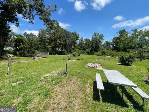 a view of a backyard with a slide