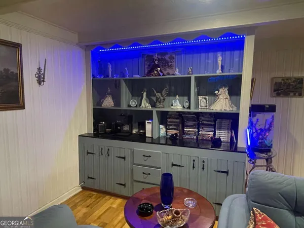 a room with wooden furniture and a fireplace