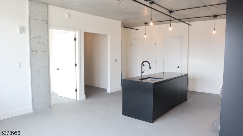 59 McWhorter Street, Unit 405 Newark, NJ 07105 - Photo 2 of 9 a room that has a tub and a sink