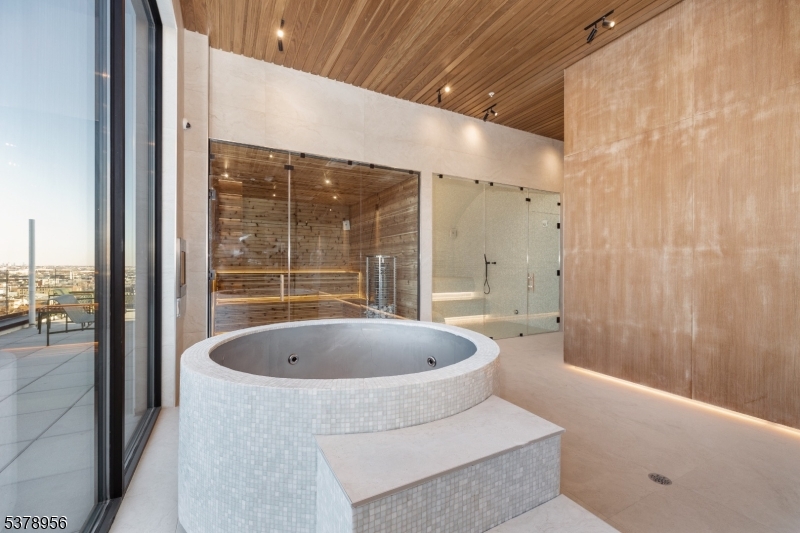 59 McWhorter Street, Unit 405 Newark, NJ 07105 - Photo 8 of 9 a spacious bathroom with a bathtub and shower