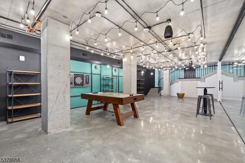 59 McWhorter Street, Unit 405 Newark, NJ 07105 - Photo 9 of 9 a view of a hall with furniture and a window