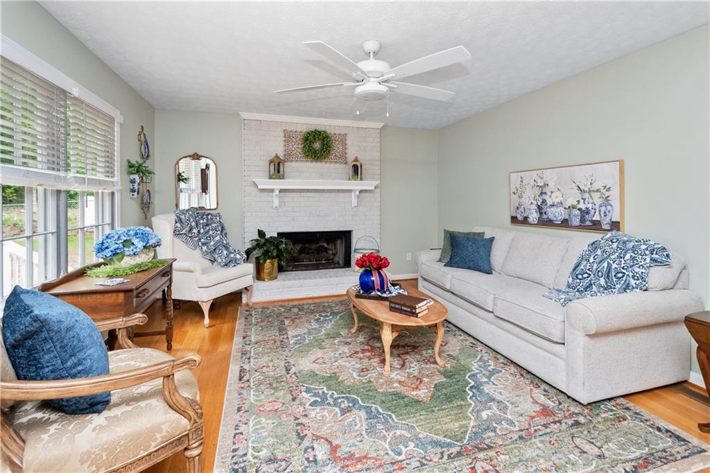 405 Ridgemont Drive Fayetteville, GA 30215 - Photo 11 of 43 a living room with furniture and a fireplace