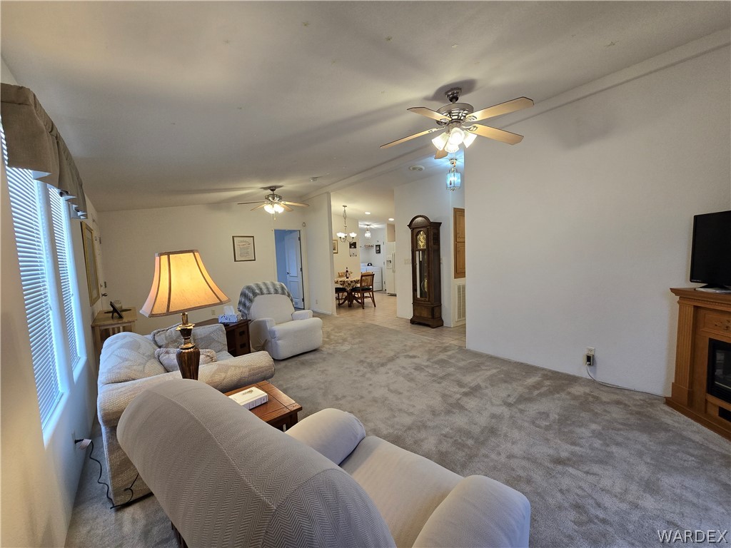 4950-17 Apache Road Golden Valley, AZ 86413 - Photo 21 of 100 a living room with furniture and a flat screen tv