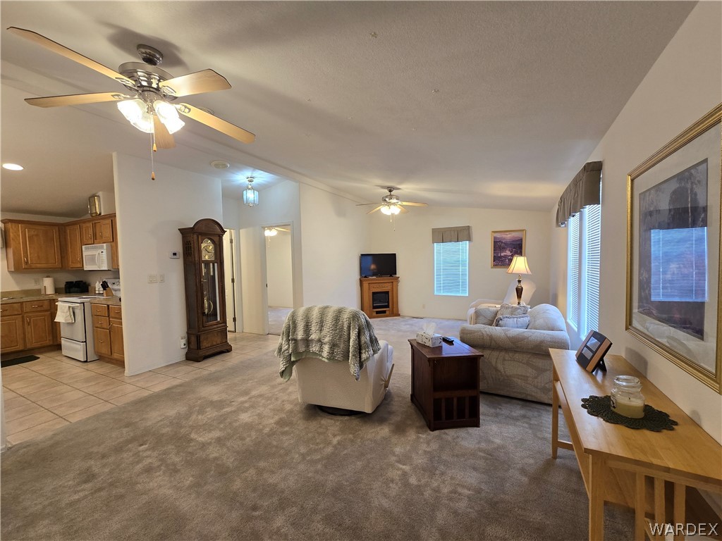 4950-17 Apache Road Golden Valley, AZ 86413 - Photo 22 of 100 a living room with furniture and a chandelier