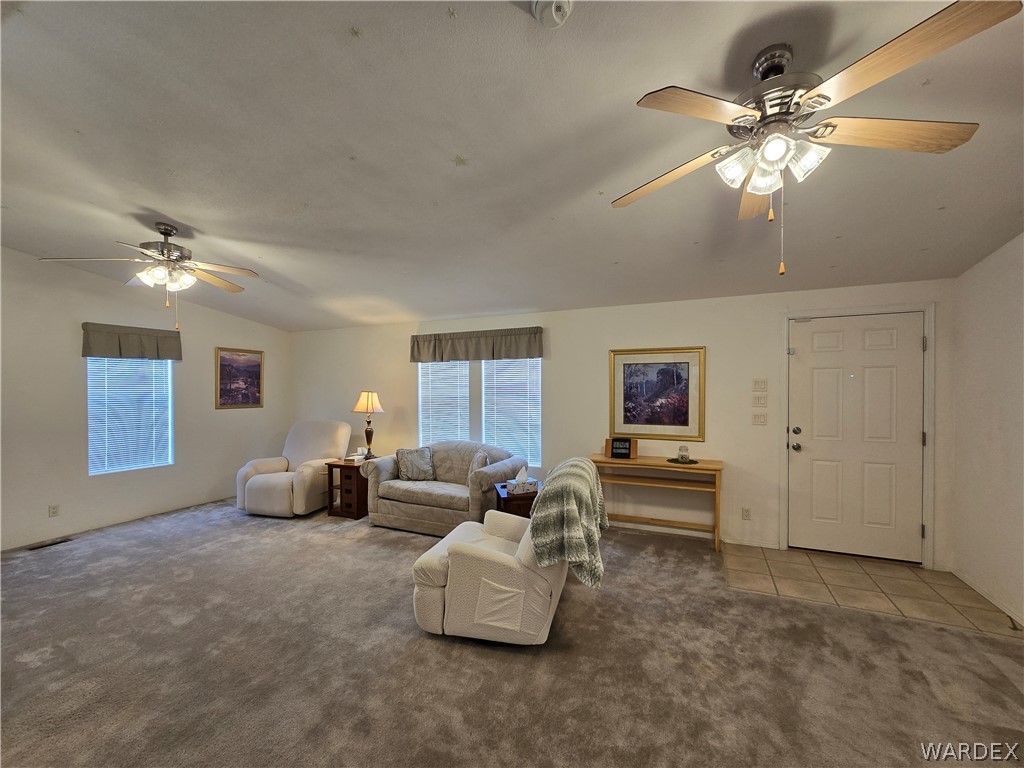 4950-17 Apache Road Golden Valley, AZ 86413 - Photo 24 of 100 a living room with furniture and a chandelier