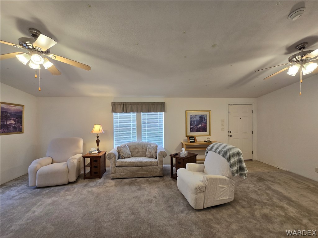 4950-17 Apache Road Golden Valley, AZ 86413 - Photo 25 of 100 a living room with furniture and a ceiling fan