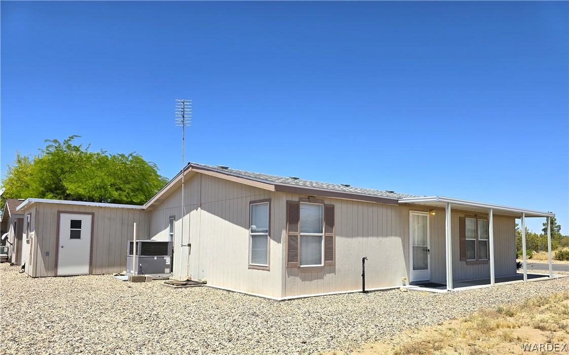 4950-17 Apache Road Golden Valley, AZ 86413 - Photo 7 of 100 a view of a house with a backyard