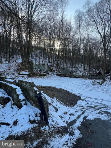 a view of a backyard of the house