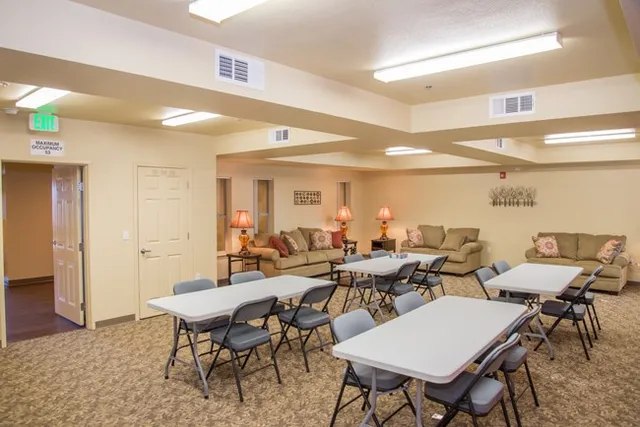 a group of people sitting at tables in a room