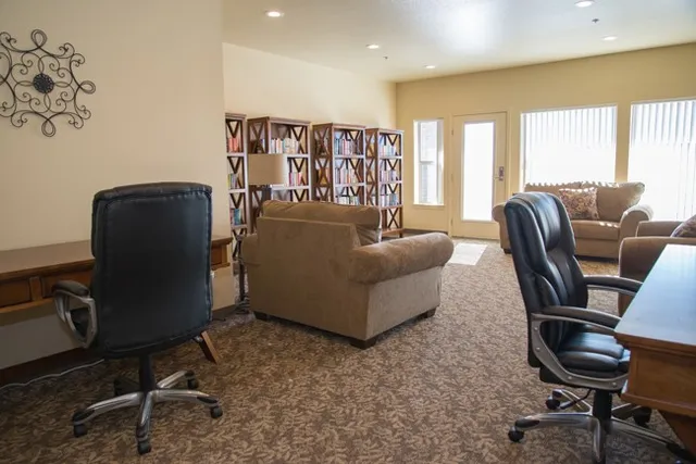a living room with furniture and a window