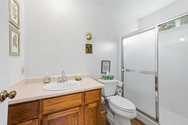 a bathroom with a sink toilet and a mirror