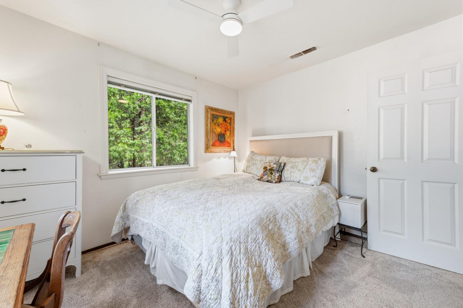 21 Spring Street Sierra City, CA 96125 - Photo 17 of 30 a bedroom with a bed lamp and a window