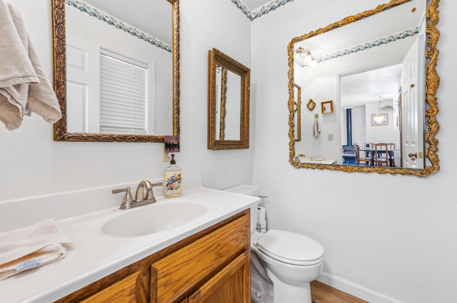 21 Spring Street Sierra City, CA 96125 - Photo 20 of 30 a bathroom with a granite countertop toilet sink and mirror
