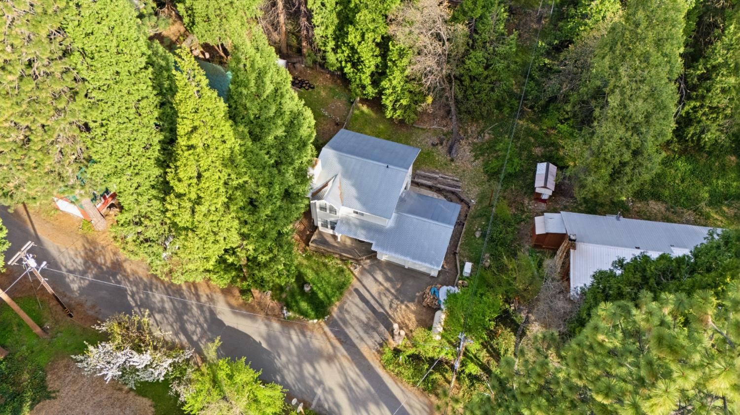 21 Spring Street Sierra City, CA 96125 - Photo 25 of 30 an aerial view of a house with a yard and garden