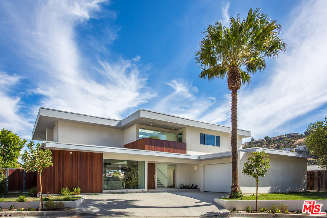 7524 Devista Drive Los Angeles, CA 90046 - Photo 2 of 54 a front view of a house with garden