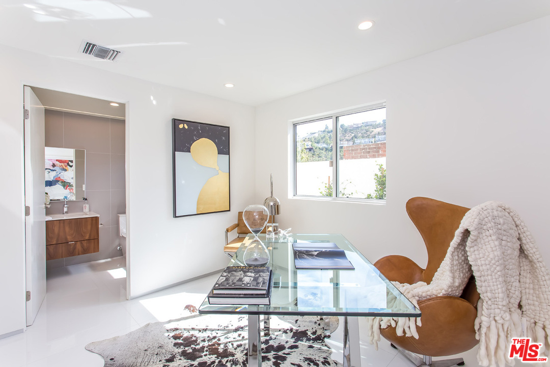 7524 Devista Drive Los Angeles, CA 90046 - Photo 16 of 54 a living room with furniture and wooden floor
