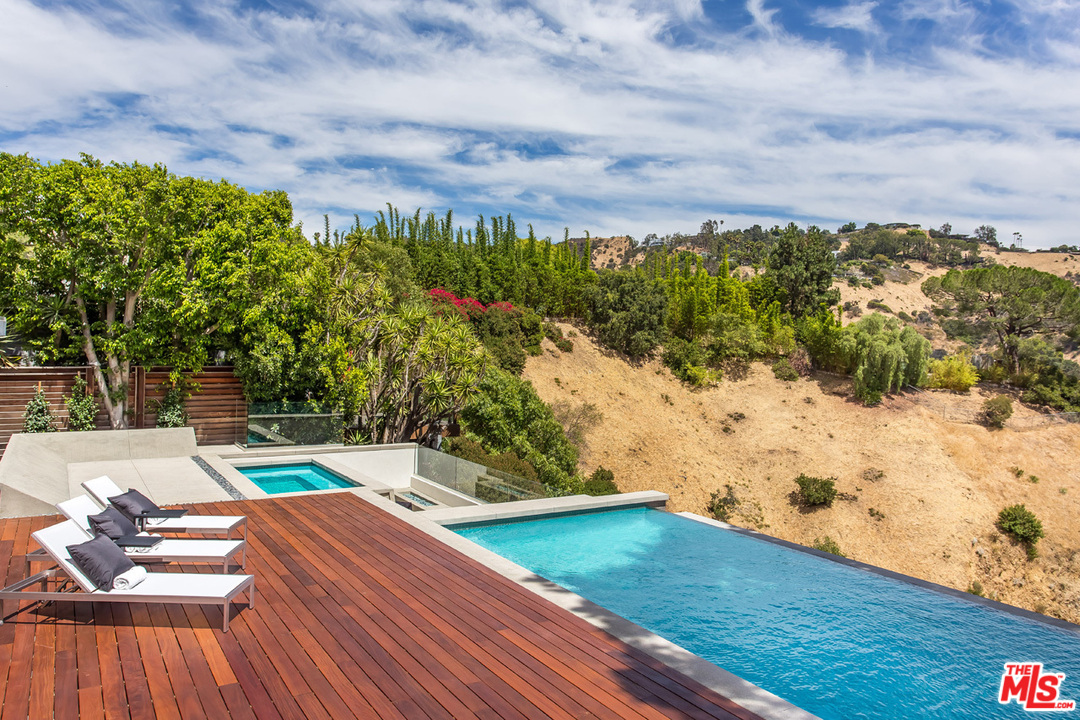 7524 Devista Drive Los Angeles, CA 90046 - Photo 23 of 54 a view of a yard with wooden floor