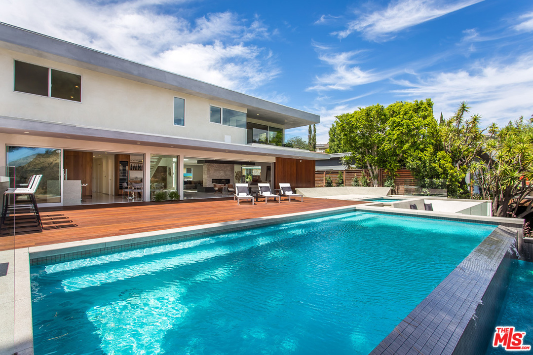 7524 Devista Drive Los Angeles, CA 90046 - Photo 25 of 54 a view of house with swimming pool outdoor seating