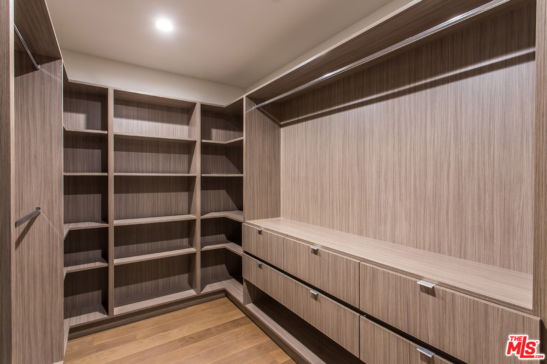 7524 Devista Drive Los Angeles, CA 90046 - Photo 32 of 54 a view of walk in closet with empty racks