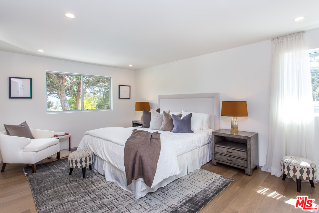 7524 Devista Drive Los Angeles, CA 90046 - Photo 33 of 54 a bedroom with a bed and a window