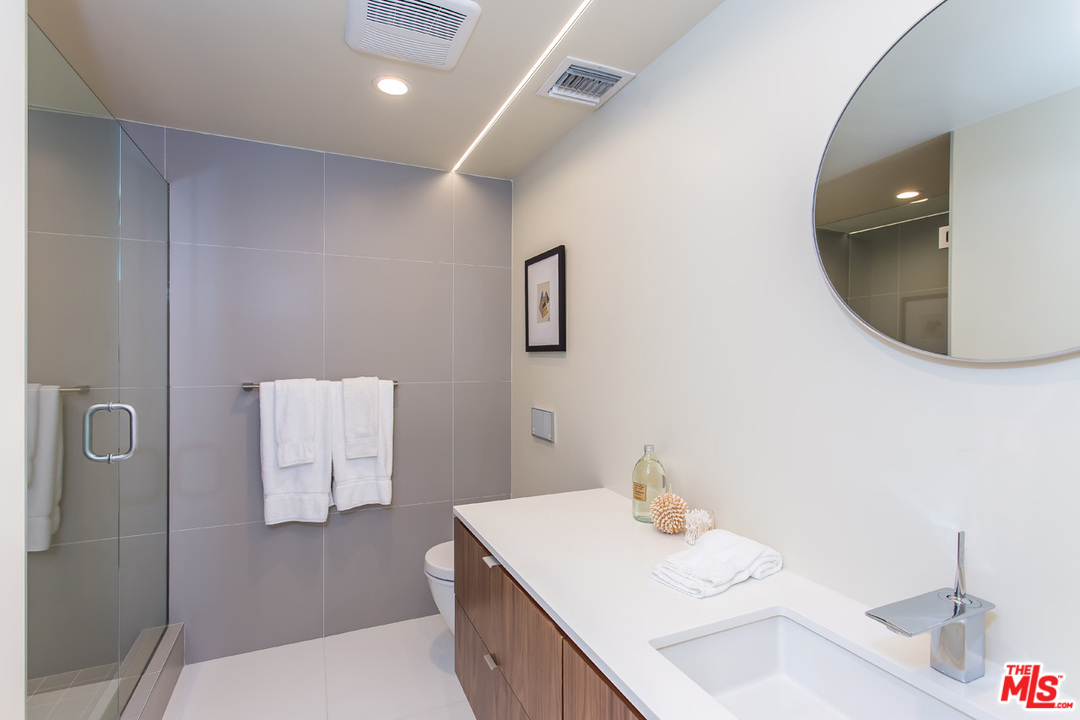 7524 Devista Drive Los Angeles, CA 90046 - Photo 34 of 54 a bathroom with a sink toilet and mirror