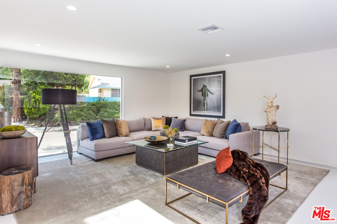 7524 Devista Drive Los Angeles, CA 90046 - Photo 5 of 54 a living room with furniture and a flat screen tv