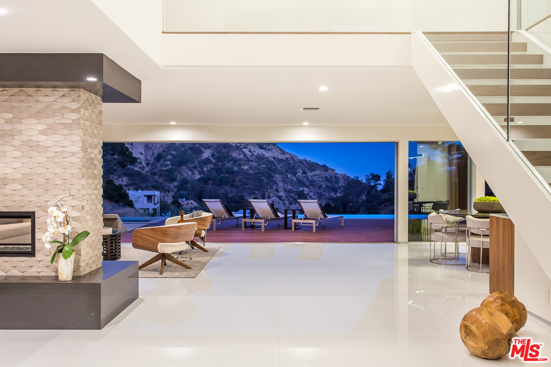 7524 Devista Drive Los Angeles, CA 90046 - Photo 42 of 54 a living room with furniture and a fireplace