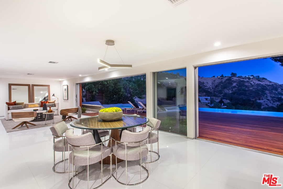 7524 Devista Drive Los Angeles, CA 90046 - Photo 45 of 54 a dining room with furniture and wooden floor