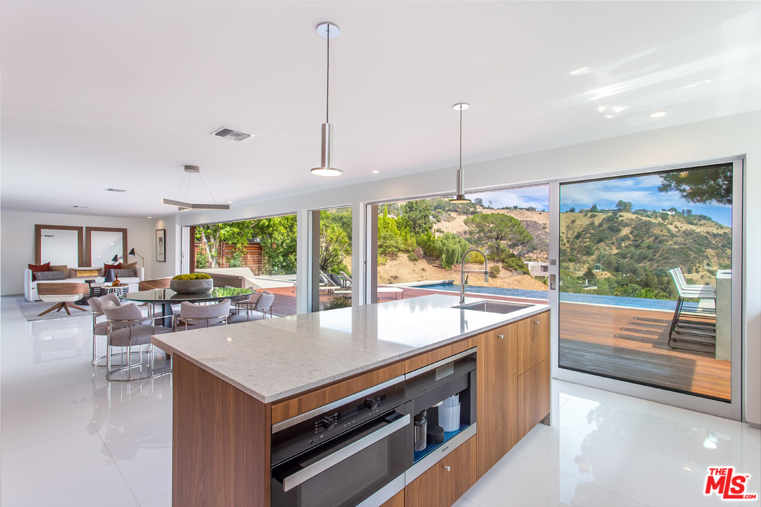 7524 Devista Drive Los Angeles, CA 90046 - Photo 10 of 54 a view of a living room and floor to ceiling window