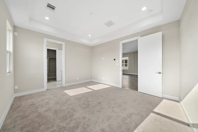 a bathroom with double vanity sink and a mirror