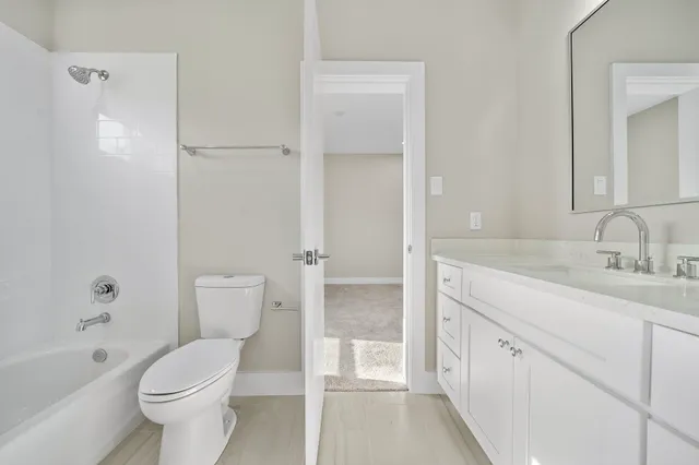 a bathroom with a toilet sink and a bathtub
