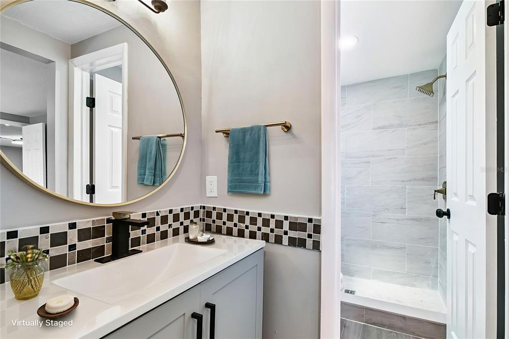 3800 Darlington Road Holiday, FL 34691 - Photo 11 of 36 a bathroom with a sink and a mirror