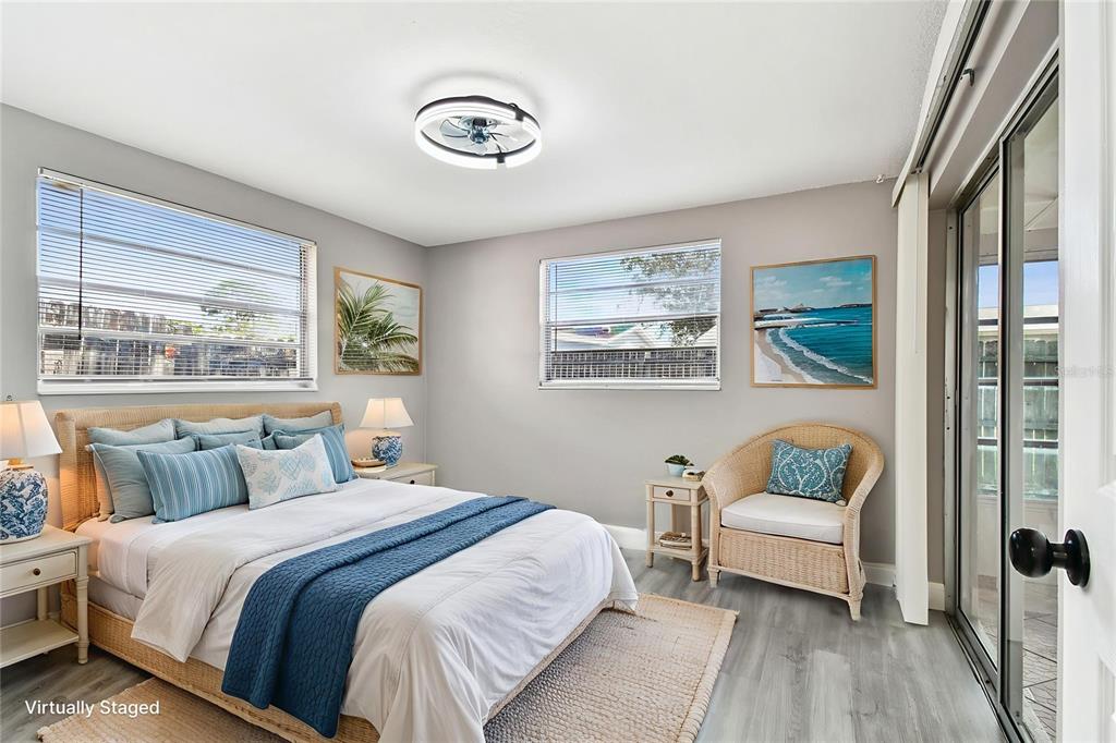 3800 Darlington Road Holiday, FL 34691 - Photo 15 of 36 a bedroom with a bed and a painting on the wall