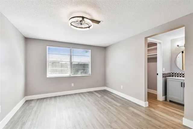 a view of an empty room with a window