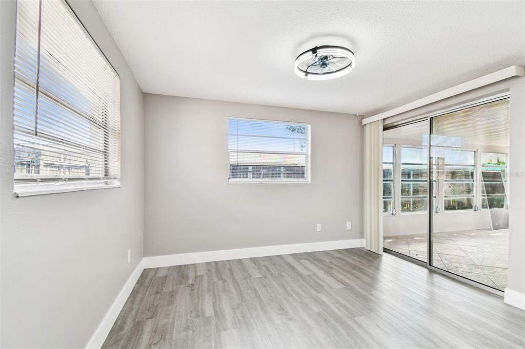 3800 Darlington Road Holiday, FL 34691 - Photo 18 of 36 a view of an empty room with wooden floor and a window