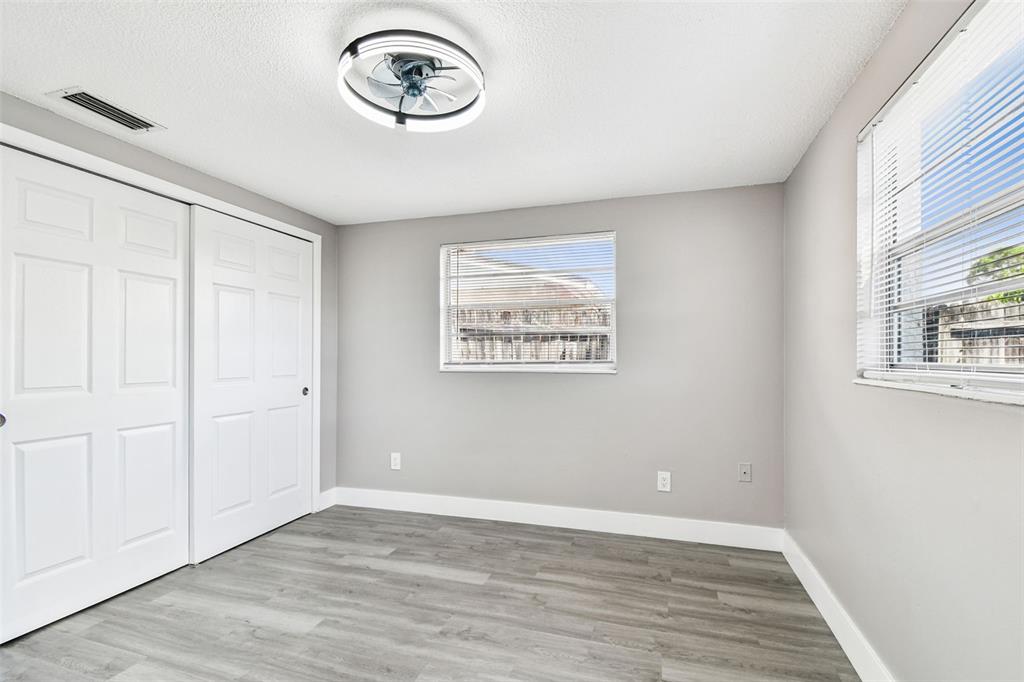 3800 Darlington Road Holiday, FL 34691 - Photo 25 of 36 a view of a hallway with wooden floor