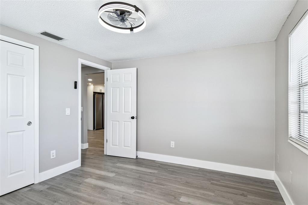 3800 Darlington Road Holiday, FL 34691 - Photo 26 of 36 an empty room with a window and a mirror