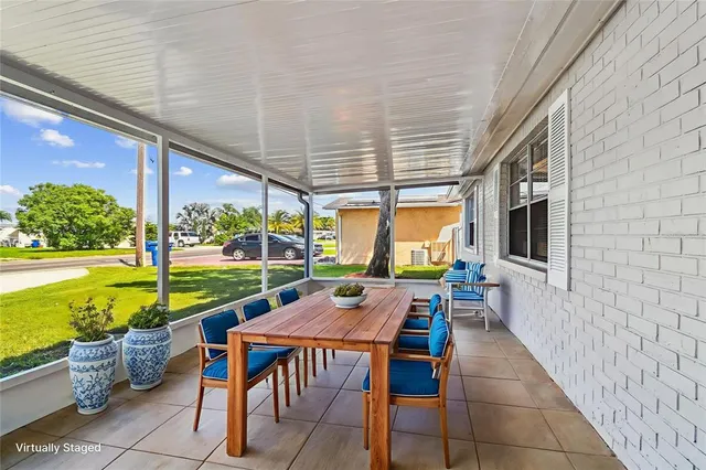 a large kitchen with granite countertop a large counter top stainless steel appliances and cabinets