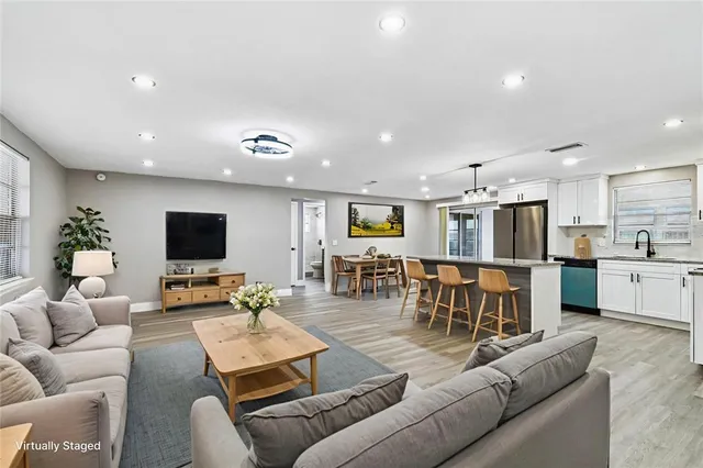 a bedroom with a bed and a television