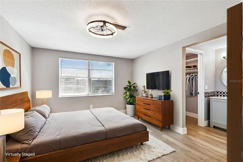 3800 Darlington Road Holiday, FL 34691 - Photo 8 of 36 a bedroom with a bed and a television