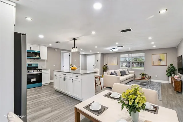 a view of a room with wooden floor